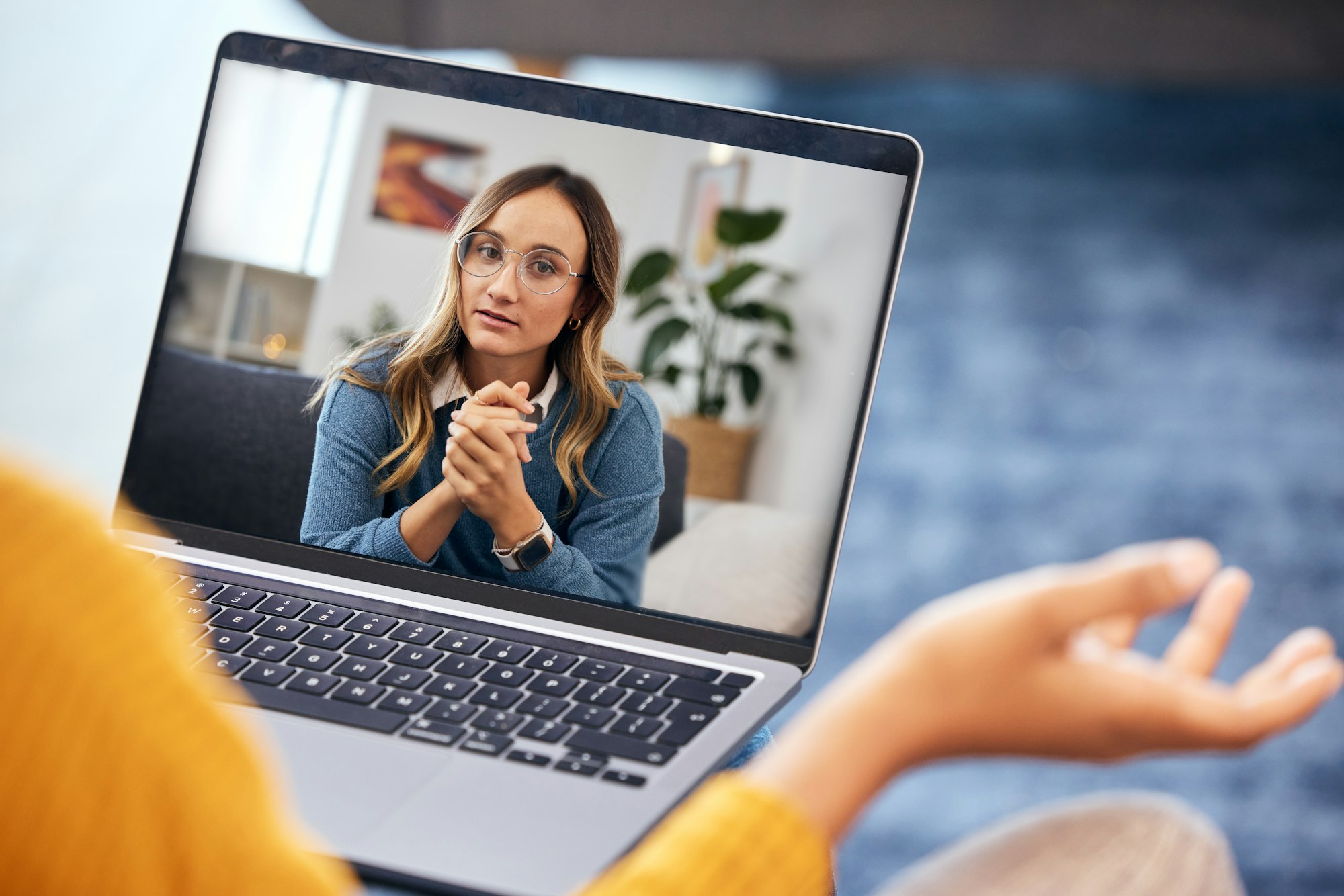 Woman, video call and therapy on laptop screen for support, advice or helping with mental health in